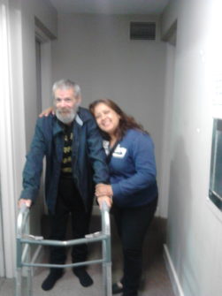George and Norma, delivering a donated walker