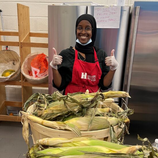 North York Harvest staff with fresh corn and vegetables