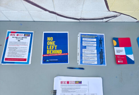 A table with literature and a petition sign-up for the North York Harvest Food Bank.