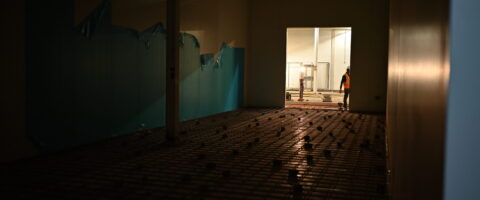 A large refrigerated space is under construction.