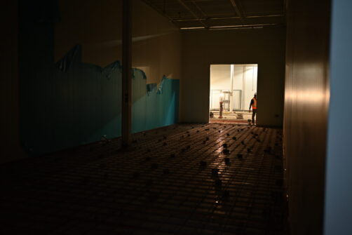 A large refrigerated space is under construction.